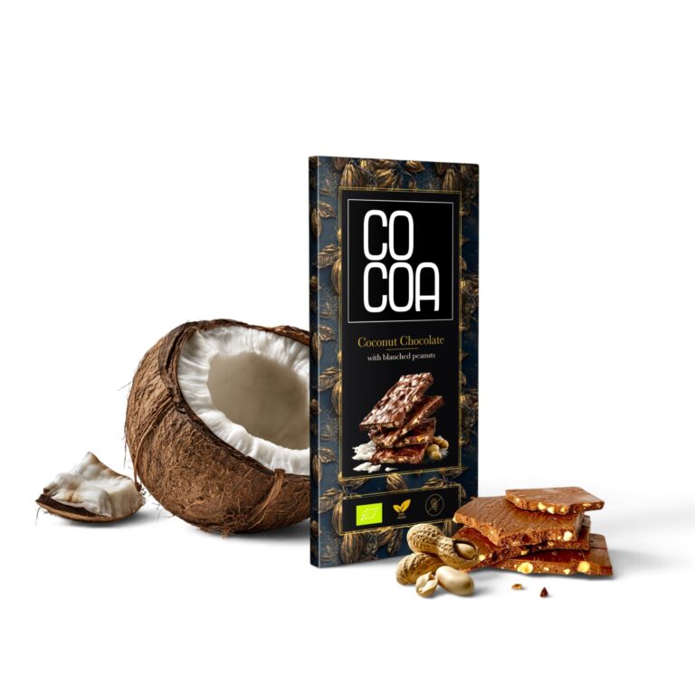 Czekolada kokosowa z orzeszkami ziemnymi COCOA obok przełamanego kokosa